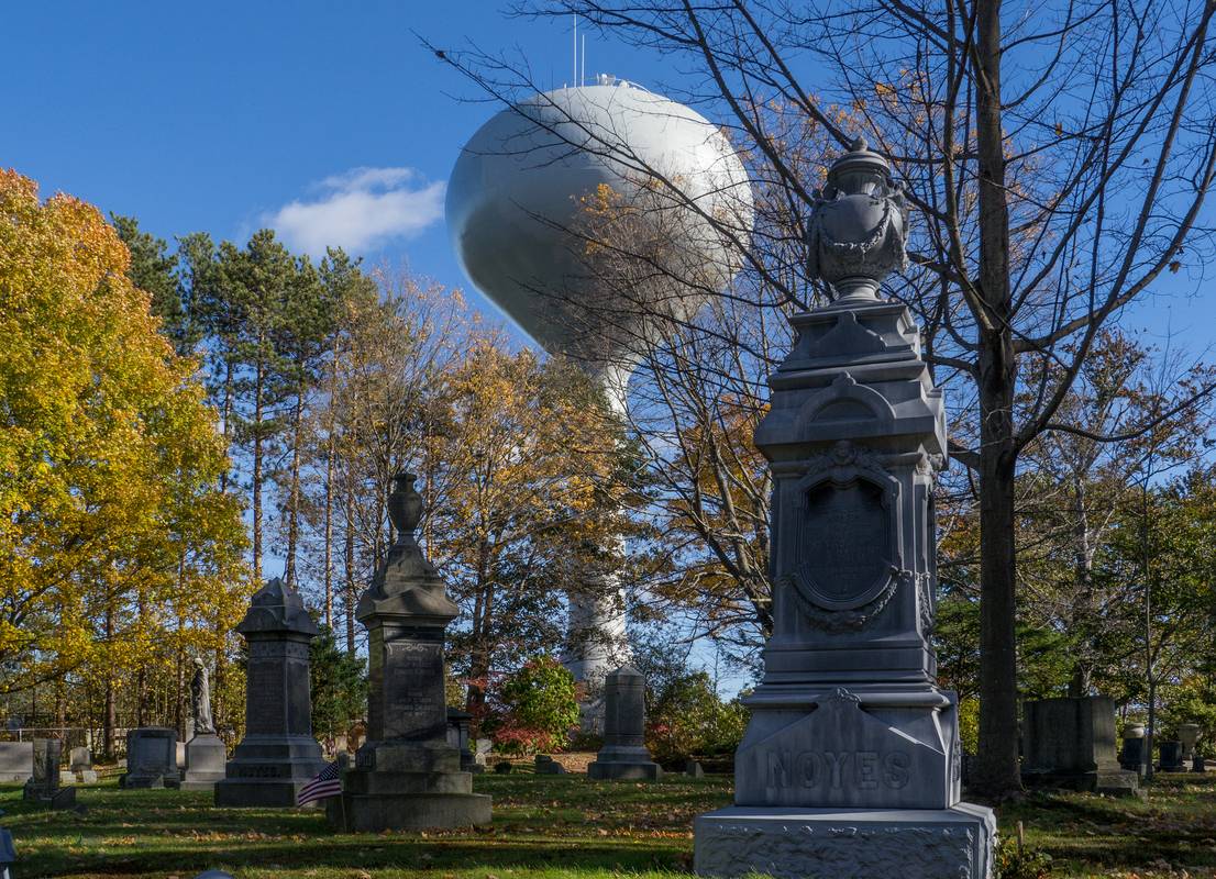Water tower just beyond the cemetery.<br />Oct. 16, 2012 - Oak Hill Cemetery, Newburyport, Massachusetts.