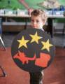Matthew showing his finished shield.<br />Nov. 25, 2012 - Higgins Armory, Worcester, Massachusetts.
