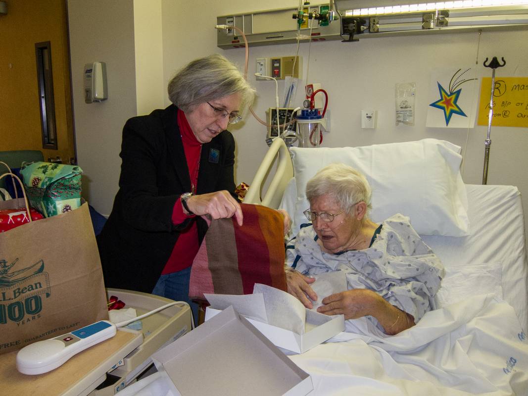 Joyce helps Marie open her Christmas presents.<br />Dec. 25, 2012 - Lawrence General Hospital.