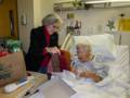 Joyce helps Marie open her Christmas presents.<br />Dec. 25, 2012 - Lawrence General Hospital.