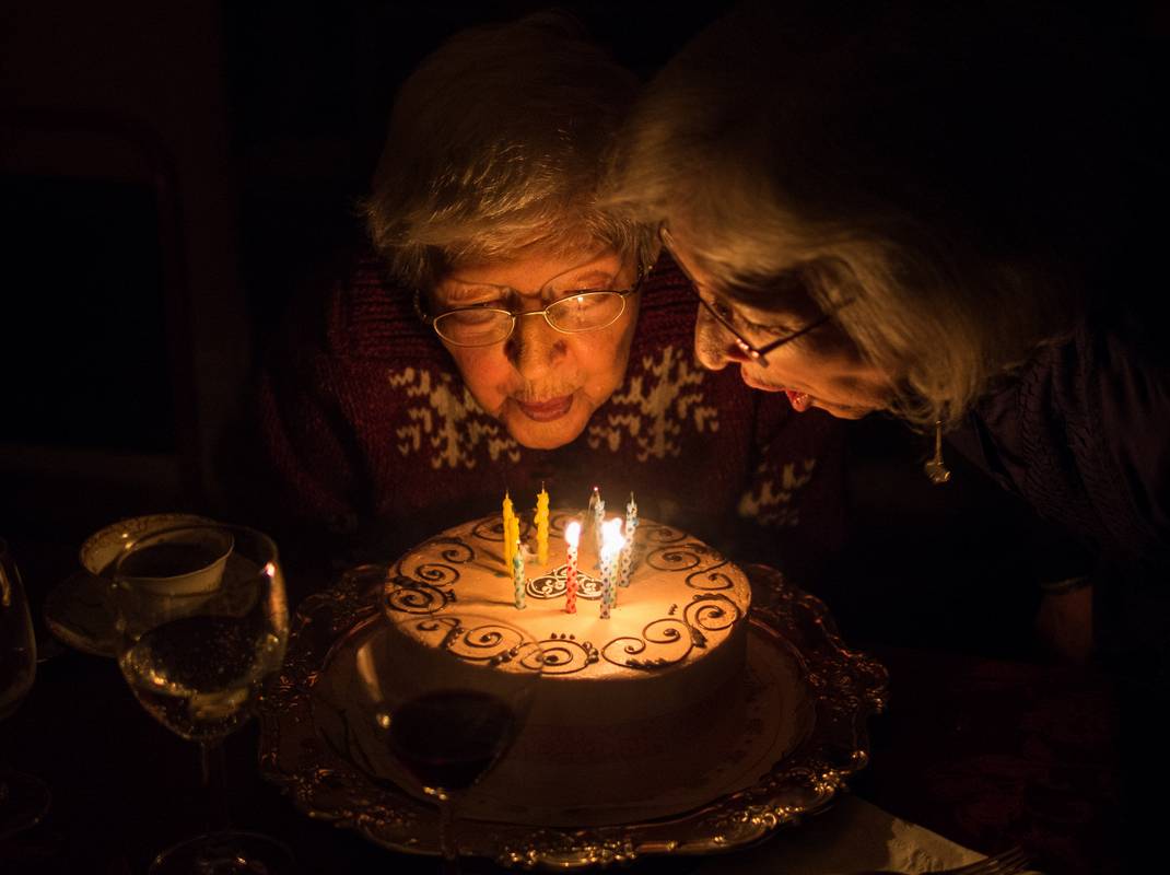 Marie and Joyce blowing out candles on Marie's 91st birthday cake.<br />Jan. 26, 2013 - At Paul and Norma's in Tewksbury, Massachusetts.