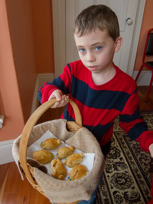 Matthew showing off the bunnies he and Miranda helped make for Easter.<br />The blue eyed ones were filled with raspberry jam, and the green eyed with apple.<br />March 31 - 2013 - Easter at Paul and Norma's in Tewksbury, Massachusetts.