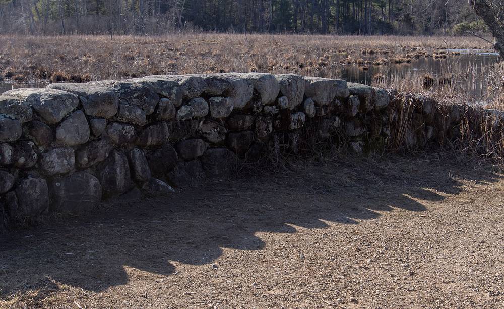 Stone bridge railing and its shasow.<br />Audubon Ipswich River Sanctuary.<br />April 4, 2013 - Topsfield, Massachusetts.