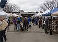 Sunday farmers' market.<br />Also a meeting place for people: my friend John looking at breads before I knew he was there.<br />April 14, 2013 - Newburyport, Massachusetts.
