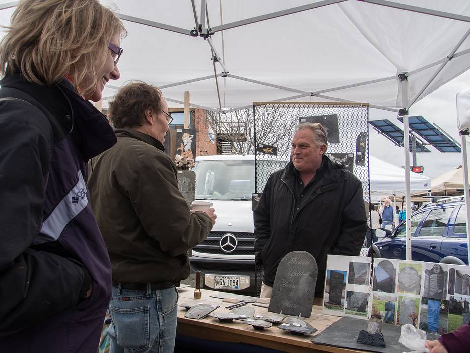 Artist Lynne and Jay talking to Michael Updake.<br />Sunday farmers' market.<br />April 14, 2013 - Newburyport, Massachusetts.