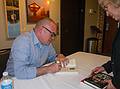 Matthew Quck sighning a book for Joyce.<br />April 26, 2013 - Firehouse Center for the Arts, Newburyport, Massachusetts.