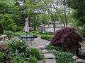 On site of a customer of one of Joyce's sculptures.<br />Joyce working on her sculpture in the background.<br />May 26, 2013 - Concord, Massachusetts.
