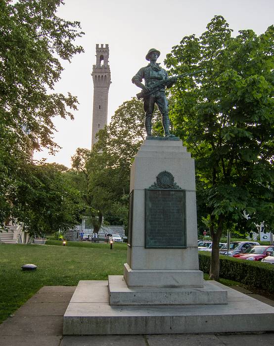 Pilgrim Monument (tower) and a monument to Provincetown men<br />who served in the First World War..<br />June 21, 2013 - Provincetown, Cape Cod, Massachusetts.