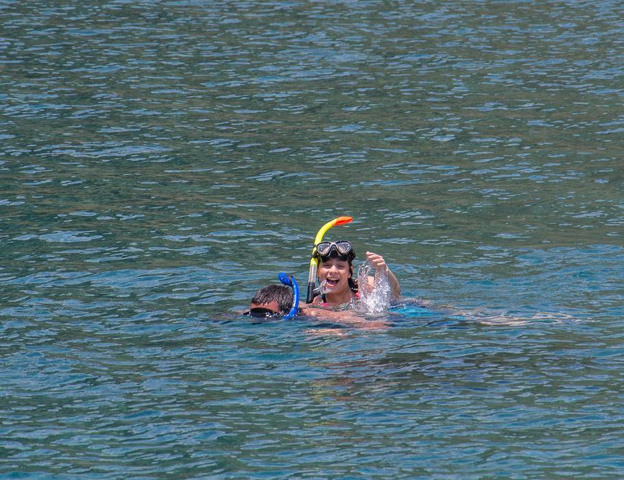 Miranda is gettng a ride on Sati's back.<br />July 10, 2013 - On island off Vila Franca do Campo, Sao Miguel, Azores, Portugal.