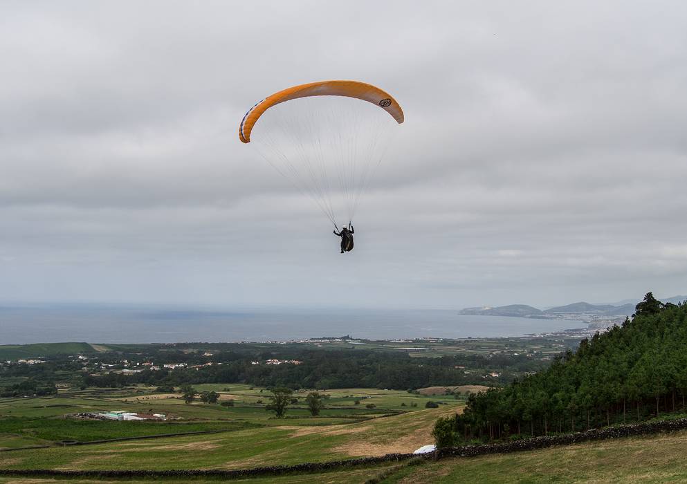 Melody airborne. North shore of the island in the background.<br />July 10, 2013 - About a mile SE of Sao Vicente Ferreira, Sao Miguel, Azores, Portugal.