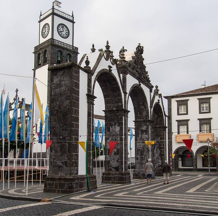 City gates with church tower in back.<br />July 10, 2013 - Ponta Delgada, Sao Miguel, Azores, Portugal.
