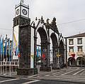 City gates with church tower in back.<br />July 10, 2013 - Ponta Delgada, Sao Miguel, Azores, Portugal.