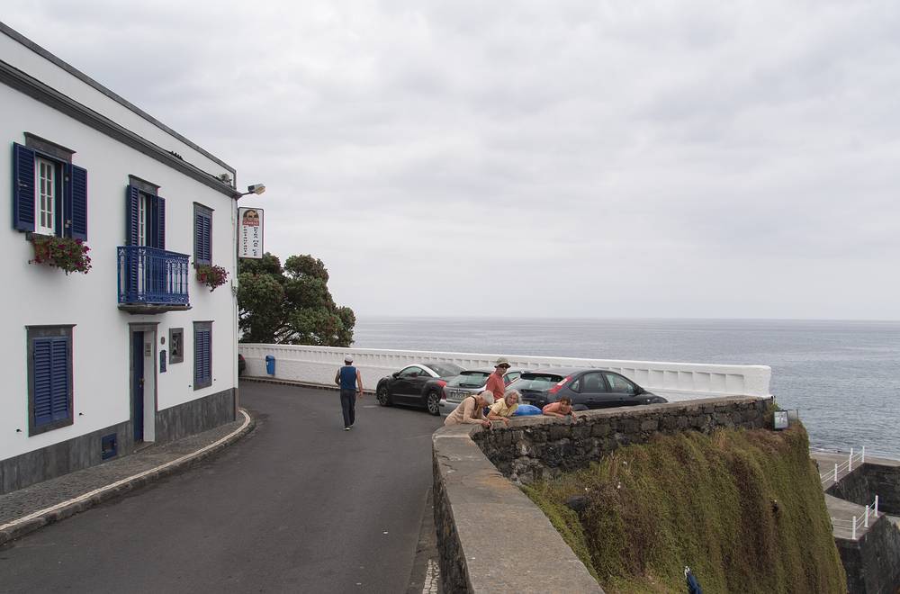 Baiba, Ronnie, Joyce, and Miranda looking at a lizard on the rocks.<br />July 12, 2013 - Lagoa, Sao Miguel, Azores, Portugal.