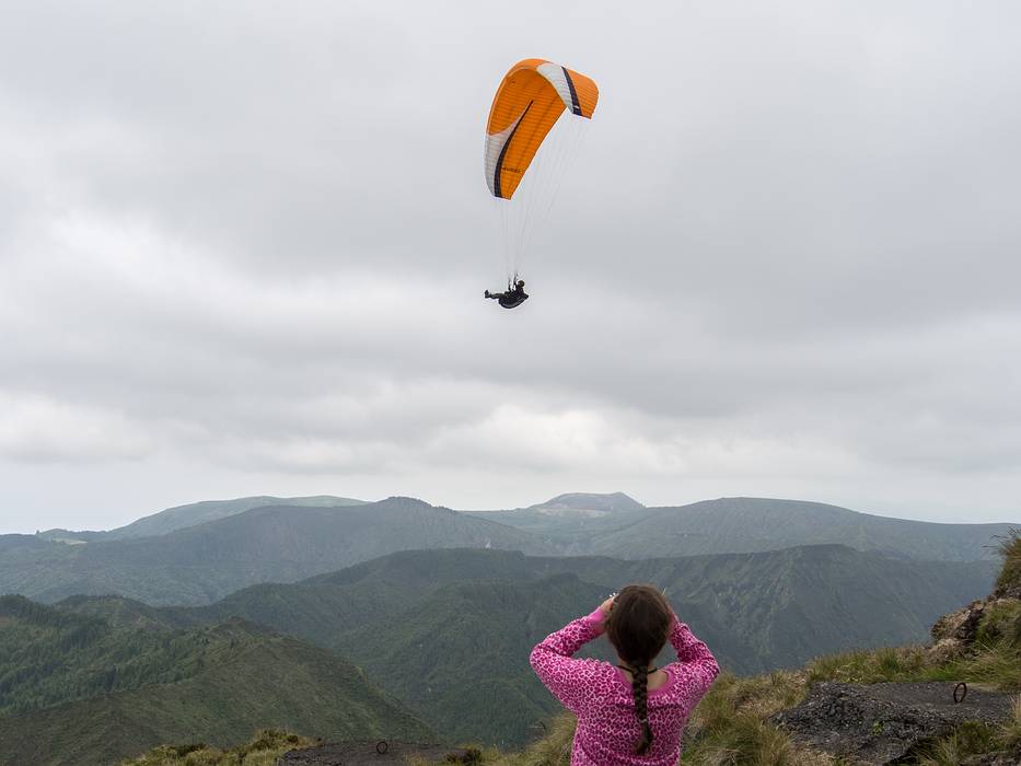 Miranda observing a second paraglider.<br />July 12, 2013 - Pico do Fogo, Sao Miguel, Azores, Portugal.