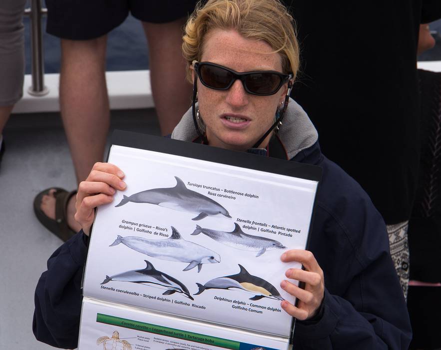 Guide explaining the dolphins that we can see.<br />July 15, 2013 - On whale watch boat out of Ponta Delgada, Sao Miguel, Azores, Portugal.