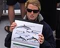 Guide explaining the dolphins that we can see.<br />July 15, 2013 - On whale watch boat out of Ponta Delgada, Sao Miguel, Azores, Portugal.