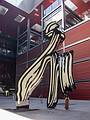 Paula and Miranda under the sculpture "Brushstroke" by Roy Lichtenstein.<br />July 3, 2013 - At the Reina Sofia Museum in Madrid, Spain.