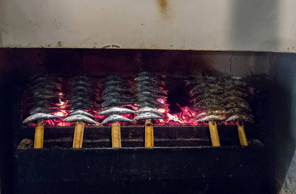 Sardines being grilled, a delicious treat.<br />July 4, 2013 - Marbella, Malaga, Spain.