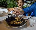 Small clams, also delicious. Paula feeding her "baby".<br />July 4, 2013 - Marbella, Malaga, Spain.