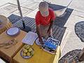 Sardines or anchovies about to be grilled.<br />This guy has been doing it for more than 30 years.<br />July 5, 2013 - Marbella, Malaga, Spain.