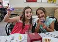 Miranda and Paula enjoying some potion (it made them guiggle) at the Bar El Cordobes.<br />July 5, 2013 - Marbella, Malaga, Spain.