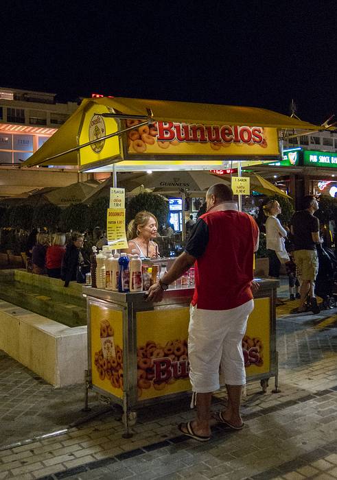 The buñuelos vendor.<br />July 5, 2013 - Puerto Banus, Marbella, Malaga, Spain.