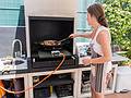 Beatriz tending the paella.<br />July 7, 2013 - At Salvador and Asuncion's in Madrid, Spain.