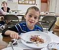 Matthew with blueberry pancakes at breakfast.<br />Merrimac Old Home Days.<br />August 10, 2013 - At the Pilgrim Church in Merrmac, Massachusetts.