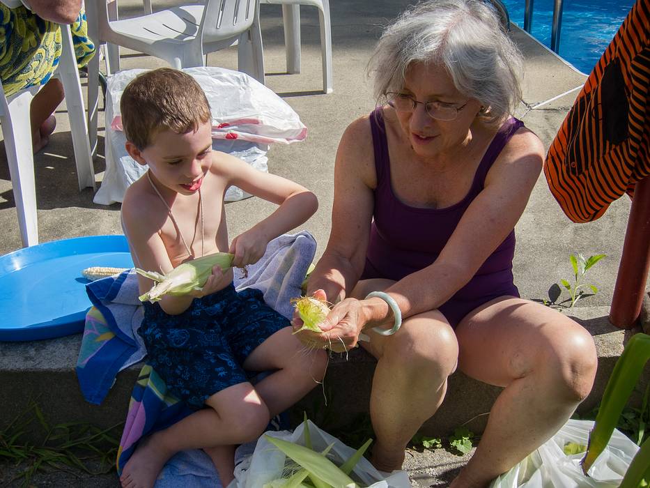 Matthew and Joyce shucking corn.<br />August 11, 2013 - At Marie's in Lawrence, Massachusetts.