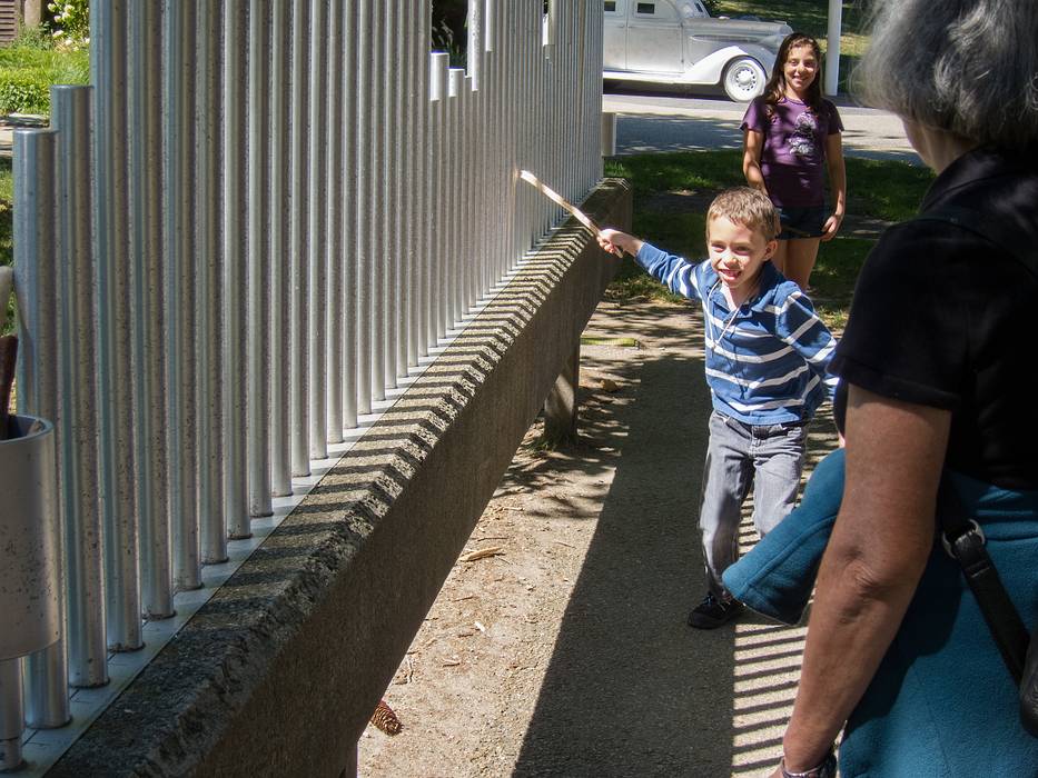 Matthew, Miranda, and Joyce.<br />Paul Matisse: 'The Musical Fence', aluminum sounding bars and reinforced concrete.<br />August 24, 2013 - DeCordova Museum, Lincoln, Massachusetts.