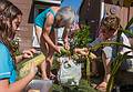 Miranda, Joyce, and Ana shucking corn.<br />August 25, 2013 - At Marie's in Lawrence, Massachusetts.