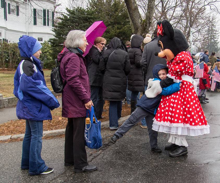 Miranda, Joyce, and Matthew hugging Minnie Mouse (Thelma).<br />Dec. 1, 2013 - Santa Parade, Merrimac, Massachusetts.
