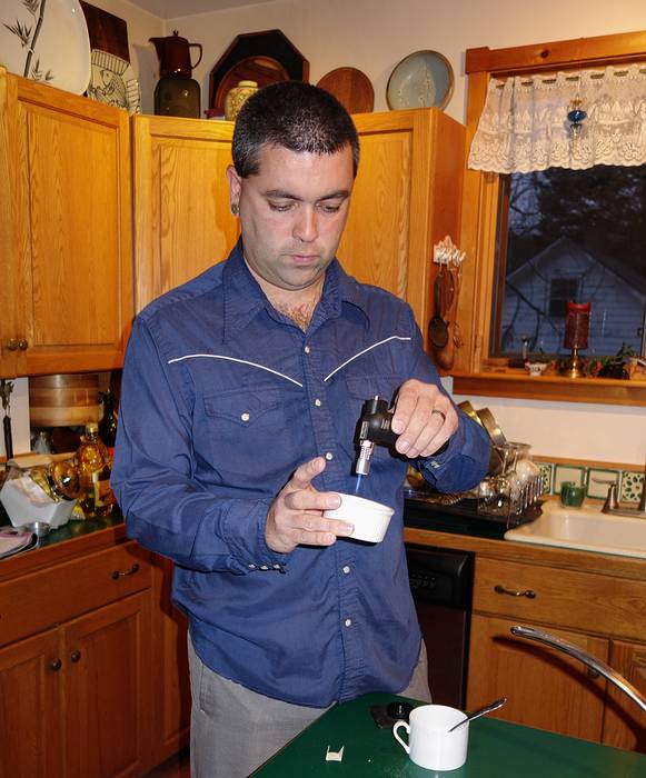 Sati making his excellent Creme Brulee for dessert.<br />Dec. 24, 2013 - Merrimac, Massachusetts.