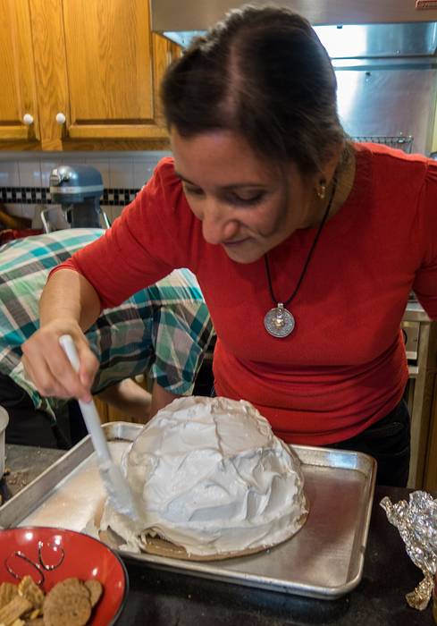 Melody covering the Baked Alaska with the meringue.<br />Dec. 25, 2013 - Christmas at Paul and Norma's in Tewksbury, Massachusetts.