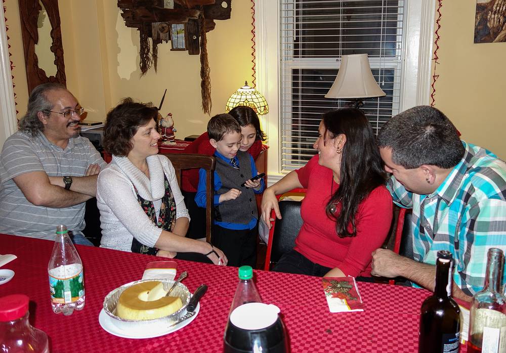 Matthew demostrating an i-pod game to Carl, Holly, Miranda, Melody, and Sati.<br />Dec. 25, 2013 - Christmas at Paul and Norma's in Tewksbury, Massachusetts.