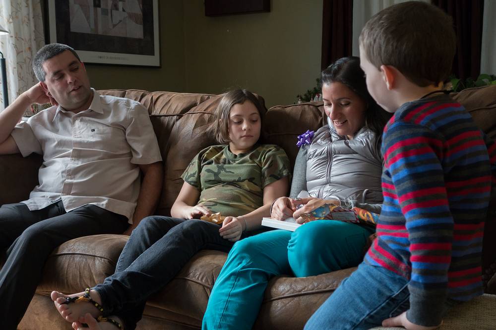 Sati, Miranda and Melody opening birthday presents, and Matthew.<br />Dec. 26, 2013 - At Carl and Holly's in Mendon, Massachusetts.