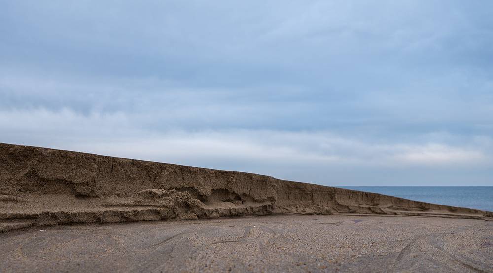 About a six inch deep channel cut into the beach at low tide.<br />A walk with Joyce off parking lot # 3.<br />Jan. 31, 2014 - Parker River National Wildlife Refuge, Plum Island, Massachusetts.