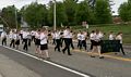 Miranda playing the saxophone in her school's band in the Memorial Day Parade.<br />Upton, Massachusetts.
