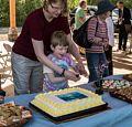 Calvin Miller about the cut the cake (with some help).<br />Sculpture naming ceremony.<br />June 1, 2014 - Nara Park, Acton, Massachusetts.
