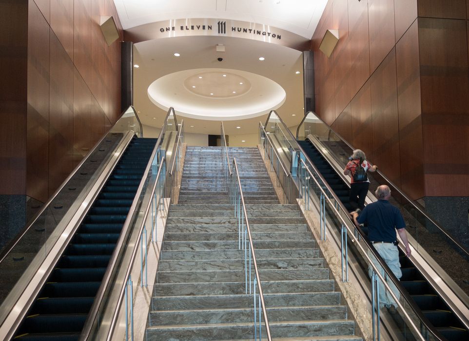 Joyce and Tom in the entrance to 111 Huntington Avenue.<br />June 8, 2014 - Boston, Massachusetts.