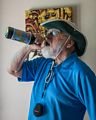 Egils showing four of his birthday presents: shirt, hat light meter, beer.<br />June 15, 2014 - Merrimac, Massachusetts.