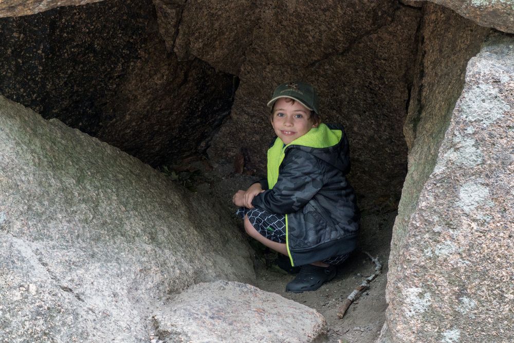 Matthew inside an erratic.<br />Aug. 21 - 2014 - The Flume, Franconia Notch, New Hampshire.