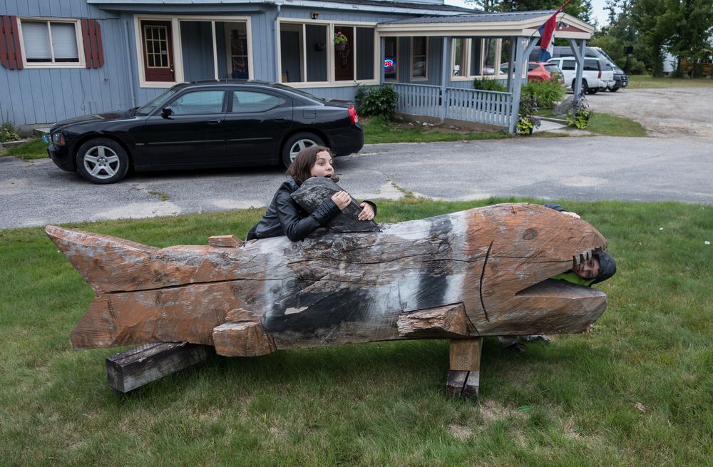 Miranda and Matthew playing with the shark in front of the Northern Embers Restaurant.<br />Aug. 21, 2014 - Twin Mountain, New Hampshire.