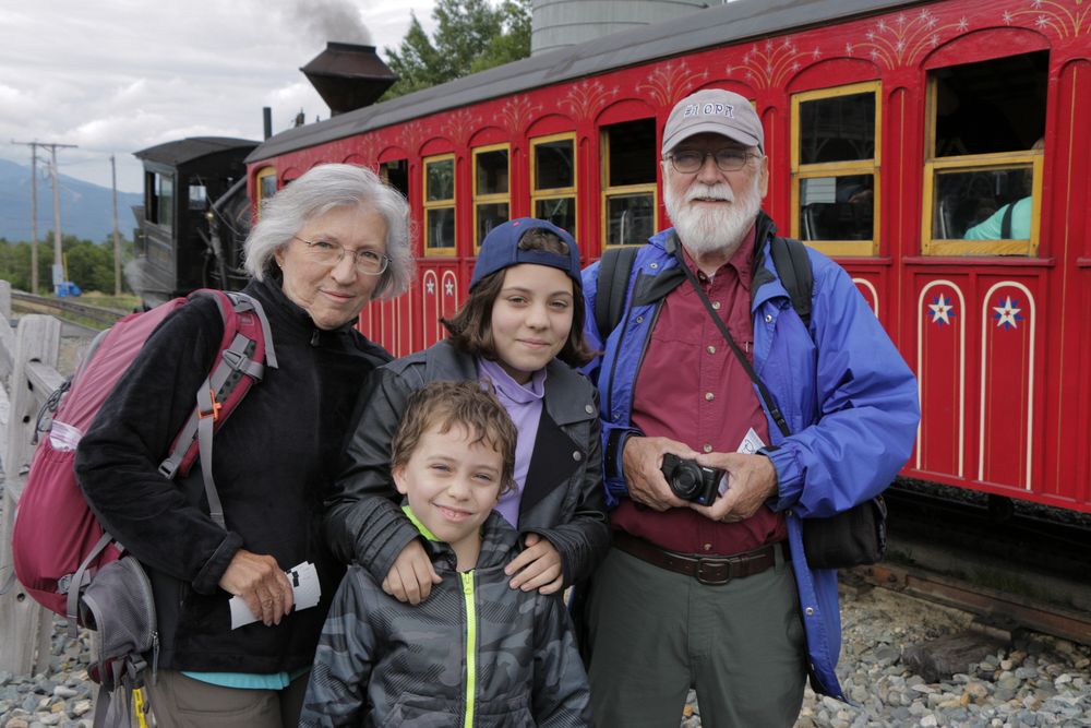 The official photographer got us before boarding.<br />Joyce, Matthew, Miranda, and Egils.<br />Aug. 22, 2014 - Cog Railway, Mount Washington, New Hampshire