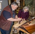Joyce being given a rivetting demo.<br />Pre-Christmas open house.<br />Dec. 6, 2014 - Lowell's Boat Shop, Amesbury, Massachusetts.