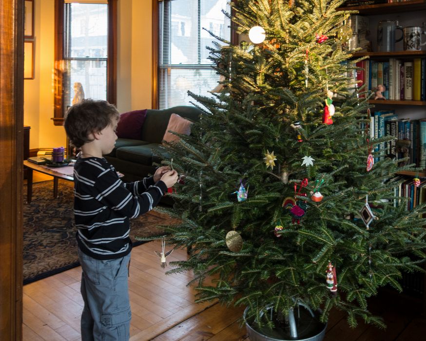 Matthew decorating our Christmas tree.<br />Dec. 14, 2014 - At home in Merrimac, Massachusetts.