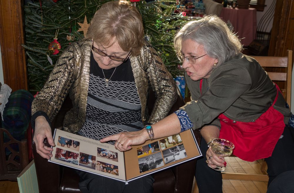 Linda with Joyce explaining something about the book she put together about  their  ancestors.<br />Dec. 25, 2014 - At home in Merrimac, Massachusetts.