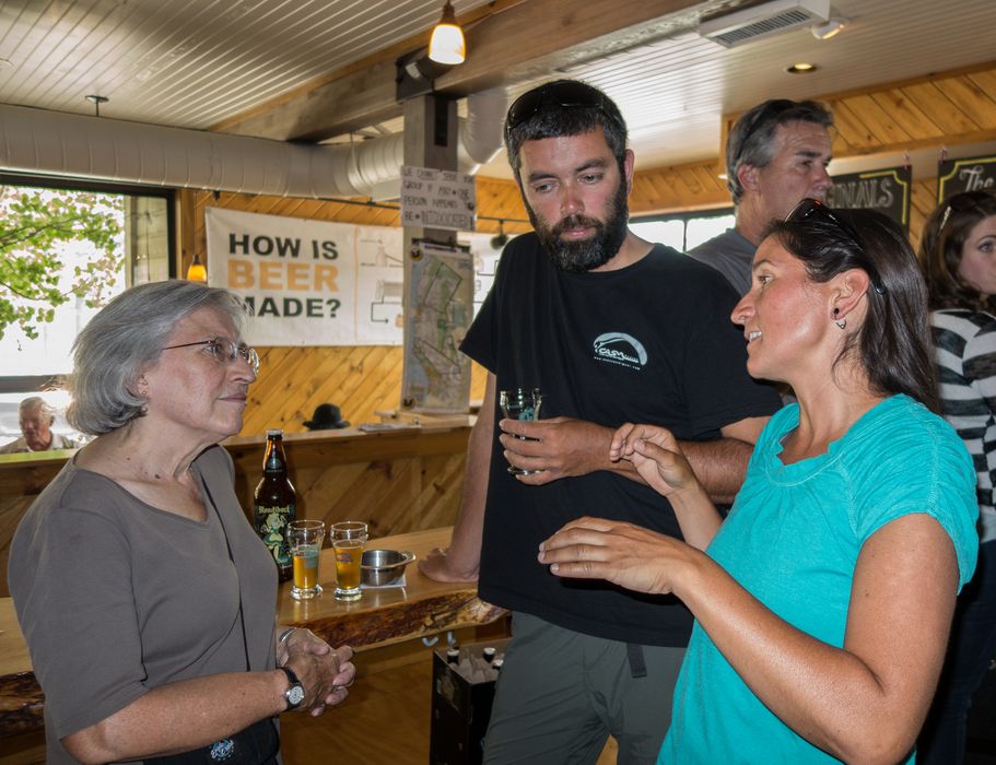 Joyce and Sati listen to Melody's stories while doing some beer tasting.<br />Aug. 1, 2014 - Mammoth Brewing Company, Mammoth Lakes, California.