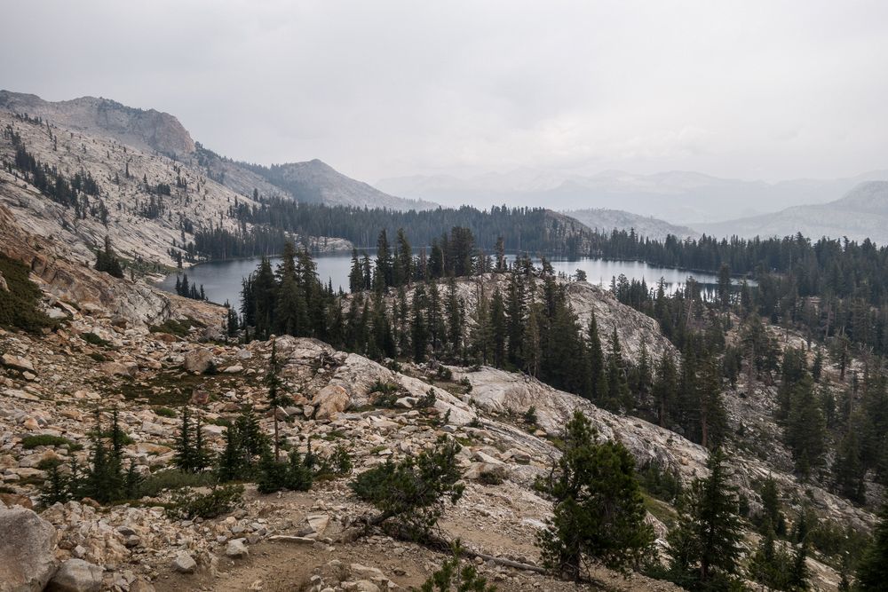 May Lake from trail up Mt. Hoffmann with smoke in the background.<br />Aug. 3, 2014 - Yosemite National Park, California.