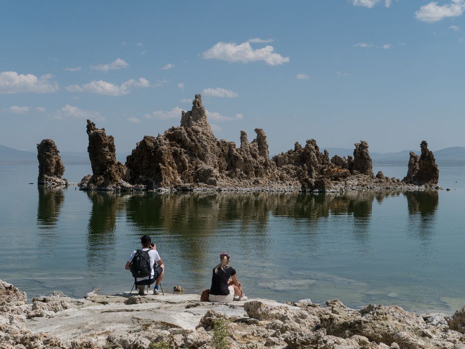 Tourists photographing and just admiring the tufas.<br />Aug. 10, 2014 - Mono Lake Tufa  State Natural Reserve, California.